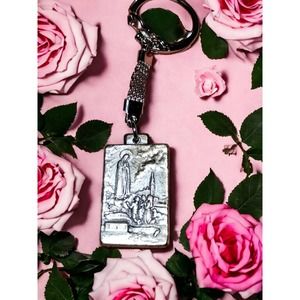 Vintage keychain-mother Mary and three children at Fatima